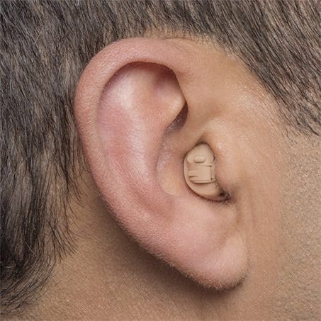 in-the-canal-hearing-aid-in-the-ear In the canal hearing aid. Shown pushed slightly into the ear canal. Barely visible.