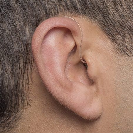 receiver-in-ear-hearing-aid-in-the-ear A Receiver in Ear Hearing Aid. Being worn by a man.