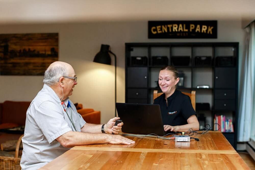 Jennifer Abbott with a senior client at an assisted living community in North Vancouver